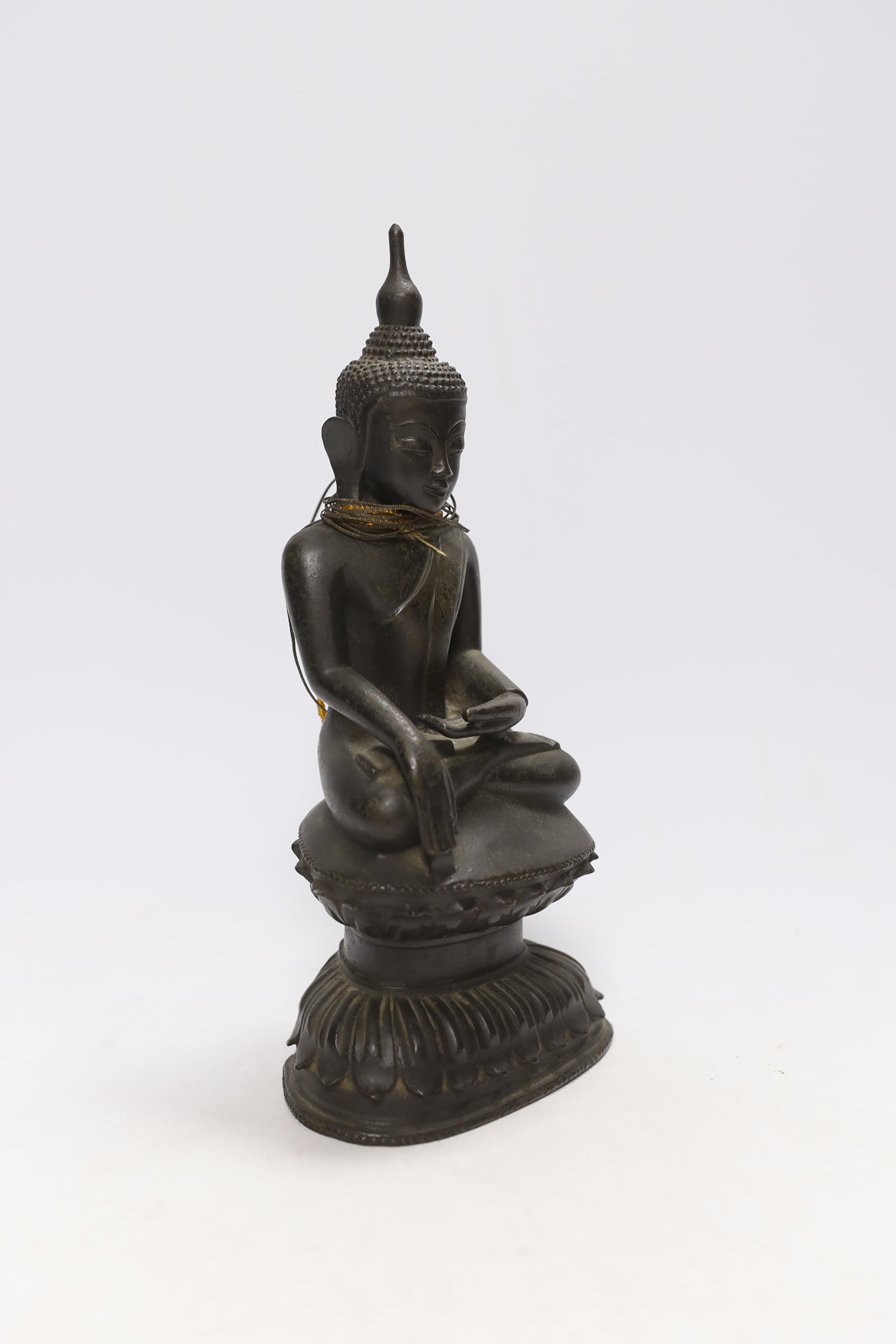 A 19th century Burmese bronze figure of Buddha, 26cm high